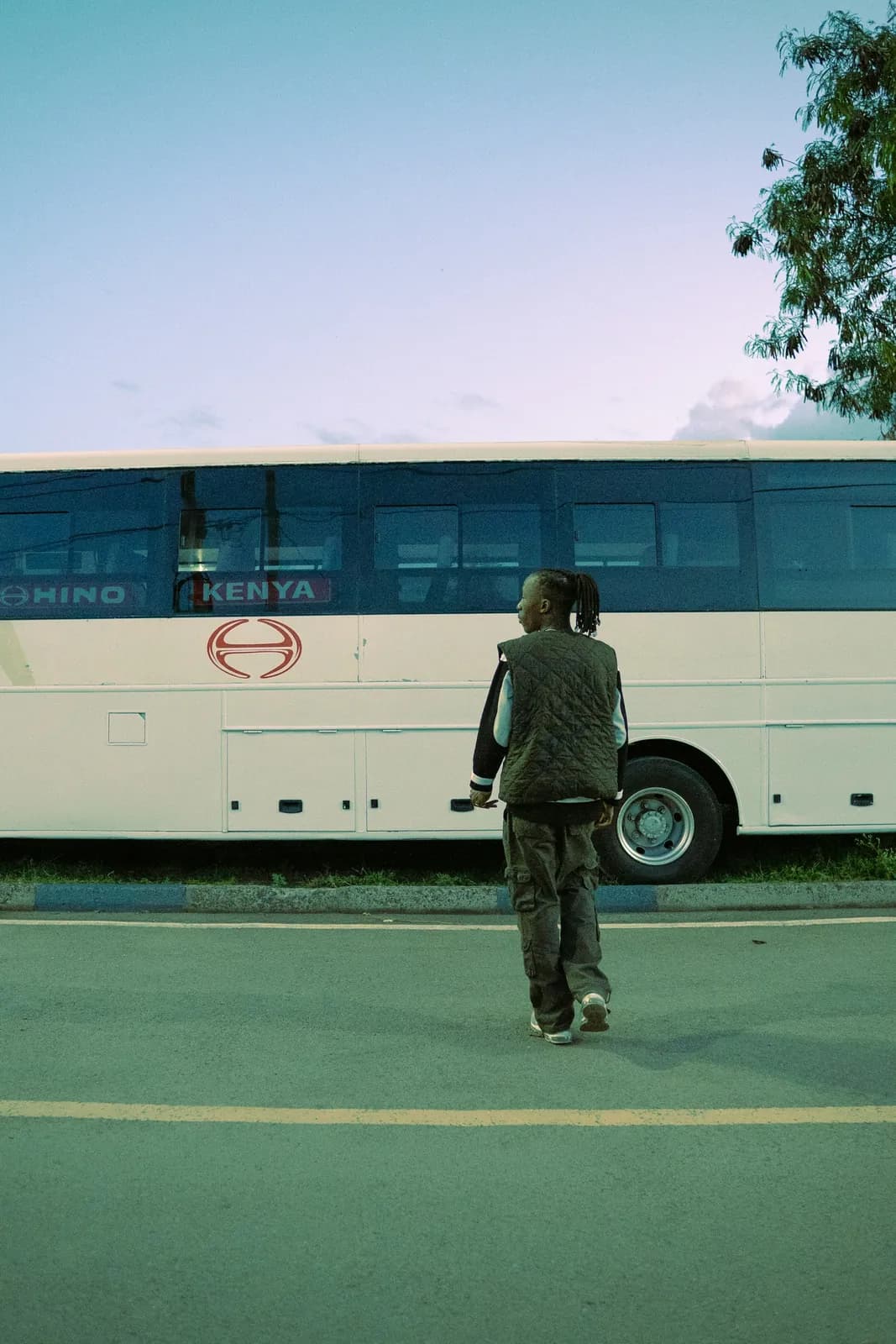 A person walking toward a bus in Nairobi